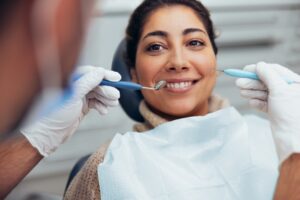 Smiling,Woman,Getting,Her,Teeth,Checked,By,Dentist.,Female,Having